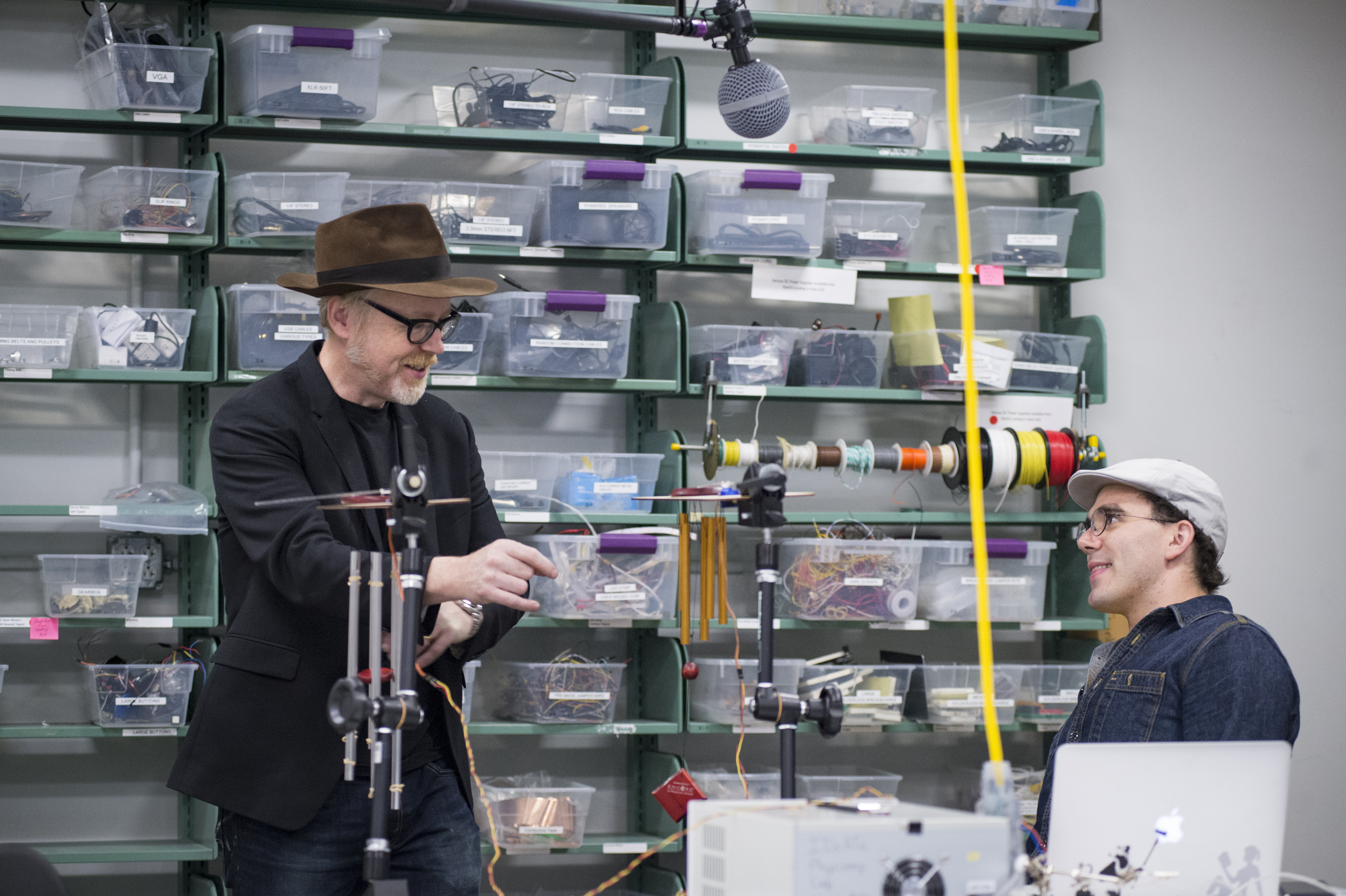 Adam Savage speaks with a student in the IDeATe Physical Computing Lab